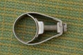 One gray metal yoke clamp with a bolt Royalty Free Stock Photo