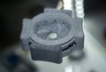 One gray model camera shutter printed on 3D printer. Object printed 3D printer