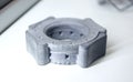 One gray model camera shutter printed on 3D printer. Object printed 3D printer