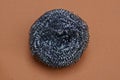 One gray round metal washcloth