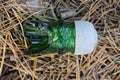 one green broken glass bottle neck with a white plastic cap Royalty Free Stock Photo
