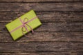 One green gift box wrapped in apple green box with red white che Royalty Free Stock Photo