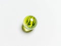 One green glass ball with caustic on a white background Royalty Free Stock Photo