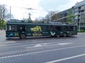 One green trolleybus on the street in Vilnius