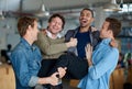 One of the guys. Group of male coworkers messing around and being silly in the office. Royalty Free Stock Photo