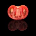 One half of the cut red tomato closeup Royalty Free Stock Photo