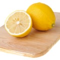 One and a half of lemon on chopping board