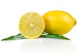 One and a half ripe lemon with green leaves