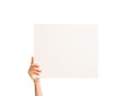 One hand holding a big white piece of cardboard. Royalty Free Stock Photo