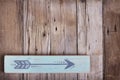 One hand painted arrow on a wooden plank