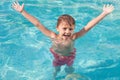 One happy child playing on the swimming pool at the day time. Royalty Free Stock Photo