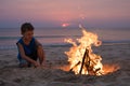 One happy little boy playing on the beach at the sunset time Royalty Free Stock Photo