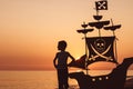 One happy little boy playing on the beach at the sunset time. Royalty Free Stock Photo