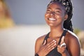 One happy young fit african american woman standing alone and pointing while feeling confident after a workout. Fit and Royalty Free Stock Photo