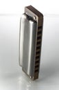 One harmonica on a white background Royalty Free Stock Photo