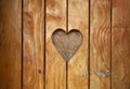 One heart shape carved in vintage wood close up Royalty Free Stock Photo