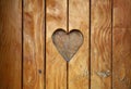 One heart shape carved in vintage wood close up