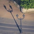 One historic lantern with long shadow from above