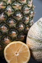 One honeydew, a fresh pineapple Royalty Free Stock Photo