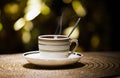 One hot tea cup spoon gold bokeh nobody Royalty Free Stock Photo