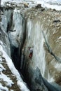 Ice climbing in one of the huge glacier crevasses of the Fedtschenko Glacier in the Pamir mountains