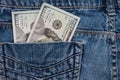 One hundred American dollars bills in pocket of blue jeans Royalty Free Stock Photo