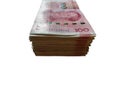 One hundred Chinese yuan money stacking isolated on white background. Royalty Free Stock Photo