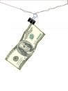 A one hundred dollar bill hangs on a wire secured by a paper clamp Royalty Free Stock Photo