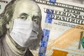 One Hundred Dollar Bill With Medical Face Mask on Benjamin Franklin Royalty Free Stock Photo