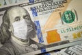 One Hundred Dollar Bill With Medical Face Mask on Benjamin Franklin Royalty Free Stock Photo