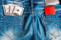 One hundred dollar bills and plastic credit card in the jeans back pocket. Royalty Free Stock Photo