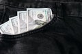 A one hundred dollar notes in the front pocket of denim trousers Royalty Free Stock Photo