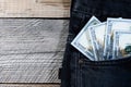 A one hundred dollar notes in the front pocket of denim trousers Royalty Free Stock Photo