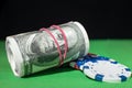 One hundred Dollar roll, poker chips on a Royalty Free Stock Photo
