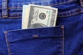 One hundred dollars in the back pocket of blue jeans Royalty Free Stock Photo