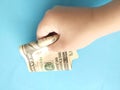 One hundred dollars in a child's hand. A bill in a child's hand Royalty Free Stock Photo