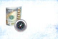 One hundred dollars and compass on abstract background Royalty Free Stock Photo
