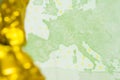 One hundred Euro banknote with golden nugget background close up Royalty Free Stock Photo