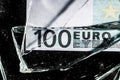 one hundred euro banknotes with broken glass. financial crisis concept Royalty Free Stock Photo