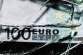 one hundred euro banknotes with broken glass. financial crisis concept Royalty Free Stock Photo