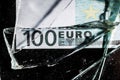 one hundred euro banknotes with broken glass. financial crisis concept Royalty Free Stock Photo