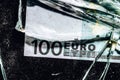 one hundred euro banknotes with broken glass. financial crisis concept Royalty Free Stock Photo