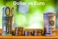 One hundred euro and one hundred US dollar rolled bills banknote Royalty Free Stock Photo