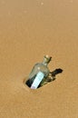 One hundred euros in a bottle in the beach Royalty Free Stock Photo