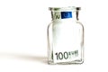 One hundred euros in a glass jar, on a white background