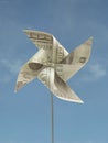 One hundred usd hand-made windmill toy Royalty Free Stock Photo