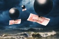 One hundred yuan in a balloon against the backdrop of stormy waves and a stormy sky Royalty Free Stock Photo