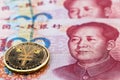 One hundred yuan banknotes, next to an e-RMB gold coin, digital version of the yuan. Concept of new digital currency of the Royalty Free Stock Photo