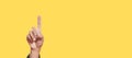 One index finger yellow background, person click button or touch pointing. Royalty Free Stock Photo