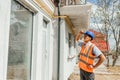 One indian builder in hardhat and vest worker inspecting works at construction site Royalty Free Stock Photo